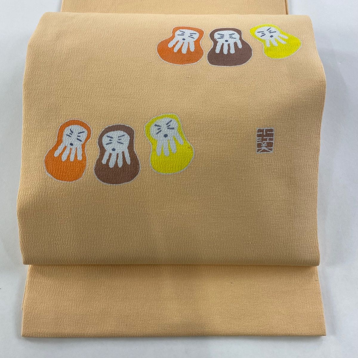 縮緬　ちりめん　生機　きばた　別織　瑞星 開き名古屋帯 美品 名品 落款 達磨 縮緬 薄オレンジ 正絹 【中古