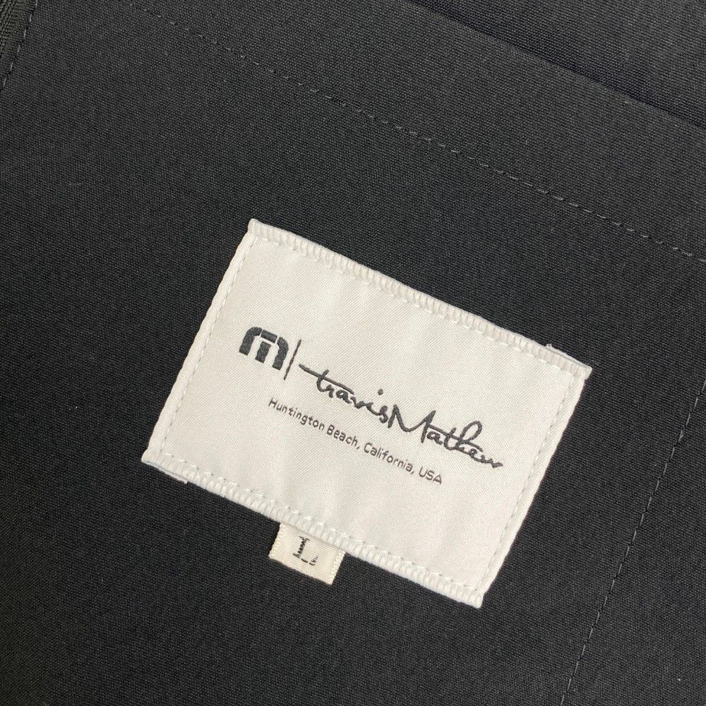 サイズ：L TRAVIS MATHEW トラビスマシュー  テーラード ジャケット  ブラック系 [240101428421] ゴルフウェア メンズ ストスト サイズ：L TRAVIS MATHEW トラビスマシュー テーラード