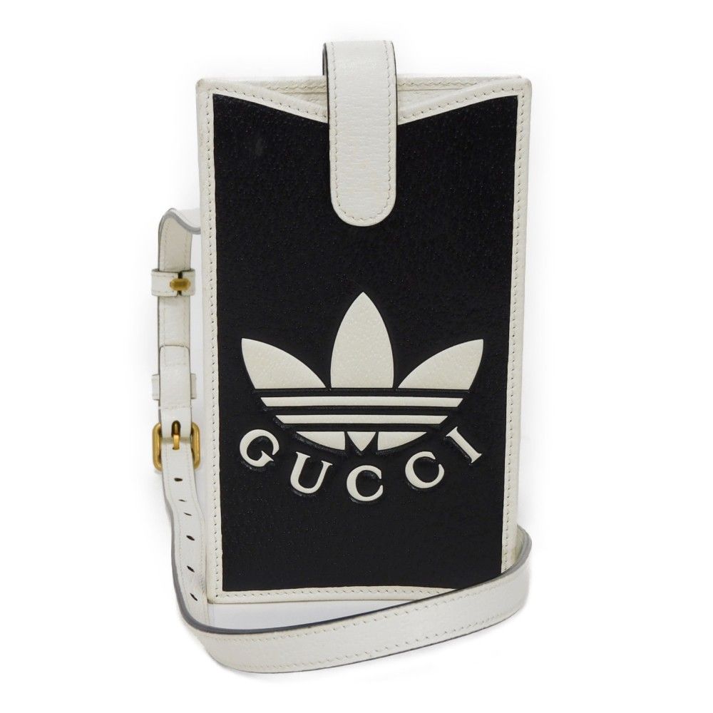 GUCCI グッチ フォン ケース トレフォイル ロゴ エンボス ホワイト バイ iPhoneケース ショルダー ストラップ アディダス ブラック スマホケース 702203 UZ3BT 1057