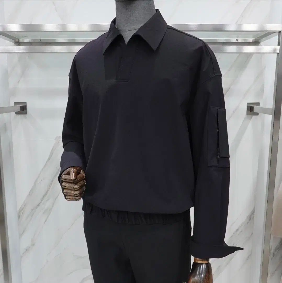 liberclaazy 黒 ウーブン ポケット ポロTシャツ 105