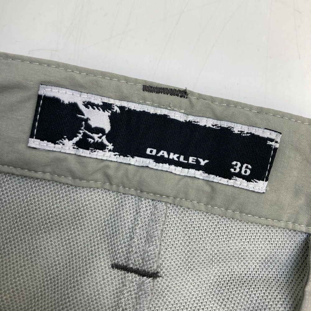 サイズ：36 OAKLEY オークリー  ストレッチパンツ ストライプ柄 グレー系 [240101498288] ゴルフウェア メンズ ストスト サイズ：36 OAKLEY オークリー ストレッチパンツ ストライプ柄