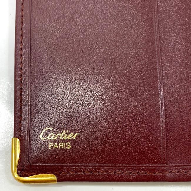 【未使用品】カルティエ 二つ折り財布 ボルドー 男女兼用 CARTIER カルティエ マストライン Wホックサイフ 二つ折り財布