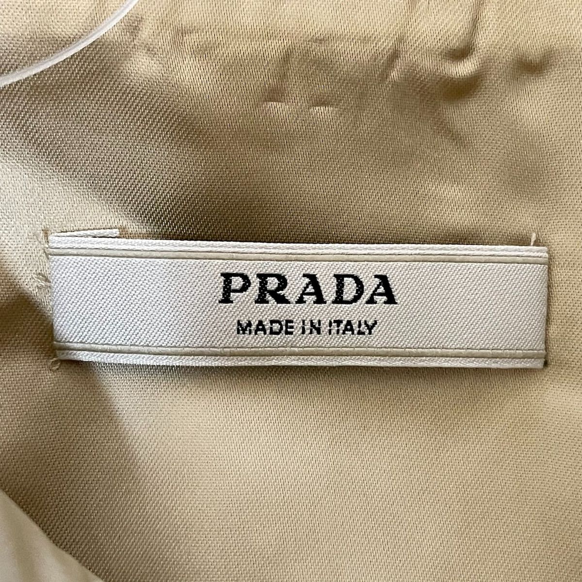 PRADA(プラダ) コート サイズ38 S レディース美品 - アイボリー 長袖 ...