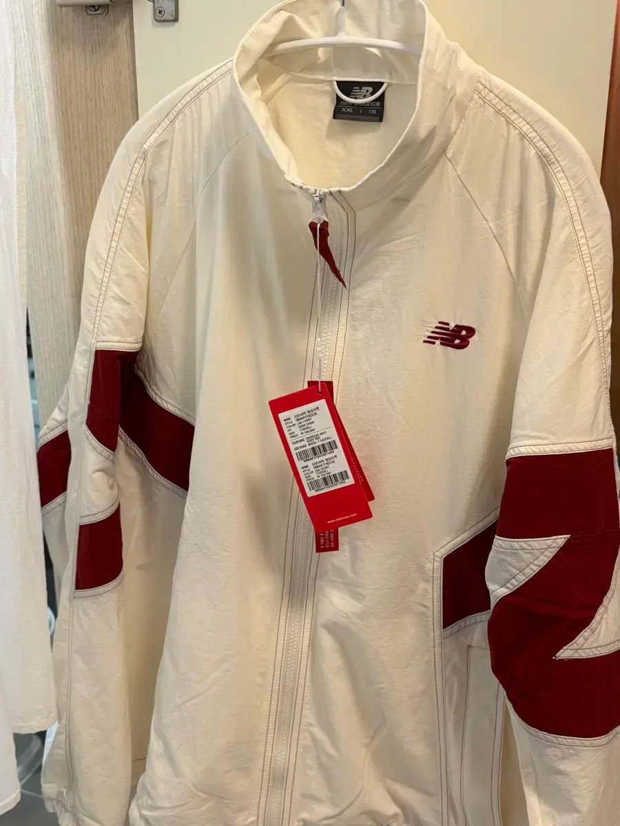 ニューバランス アイボリー ウォームアップ ジャケット