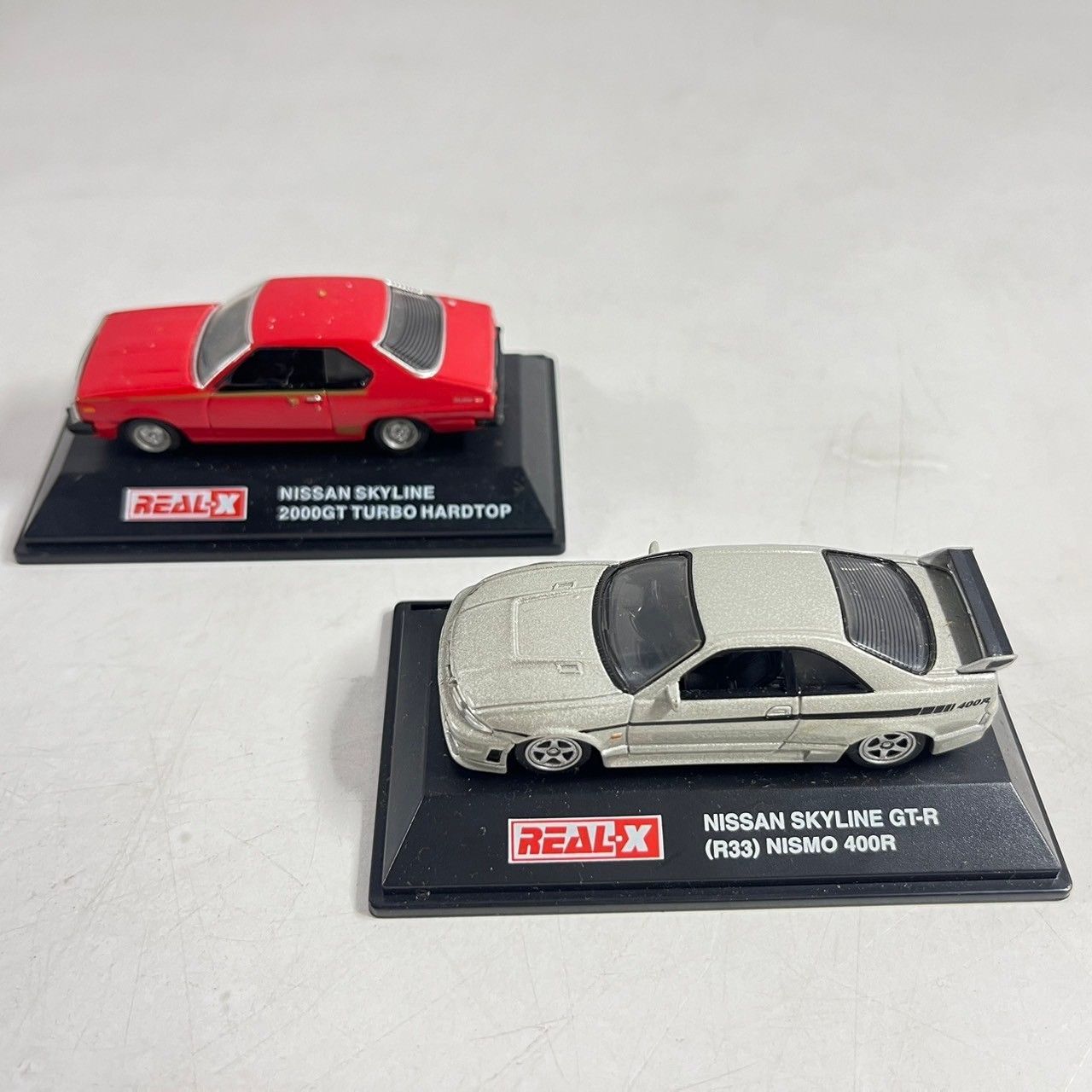 REAL-X 日産スカイラインGT-R、 HT 2000 GTターボ ミニカー 2点 REAL-X 日産スカイラインGT-R、 HT 2000 GTターボ ミニカー 2点