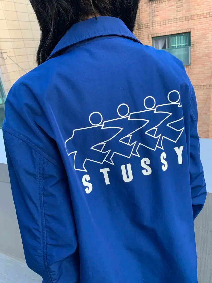 STUSSY(ステューシー) サーフマン ロゴ コーチジャケット ブランド古着
