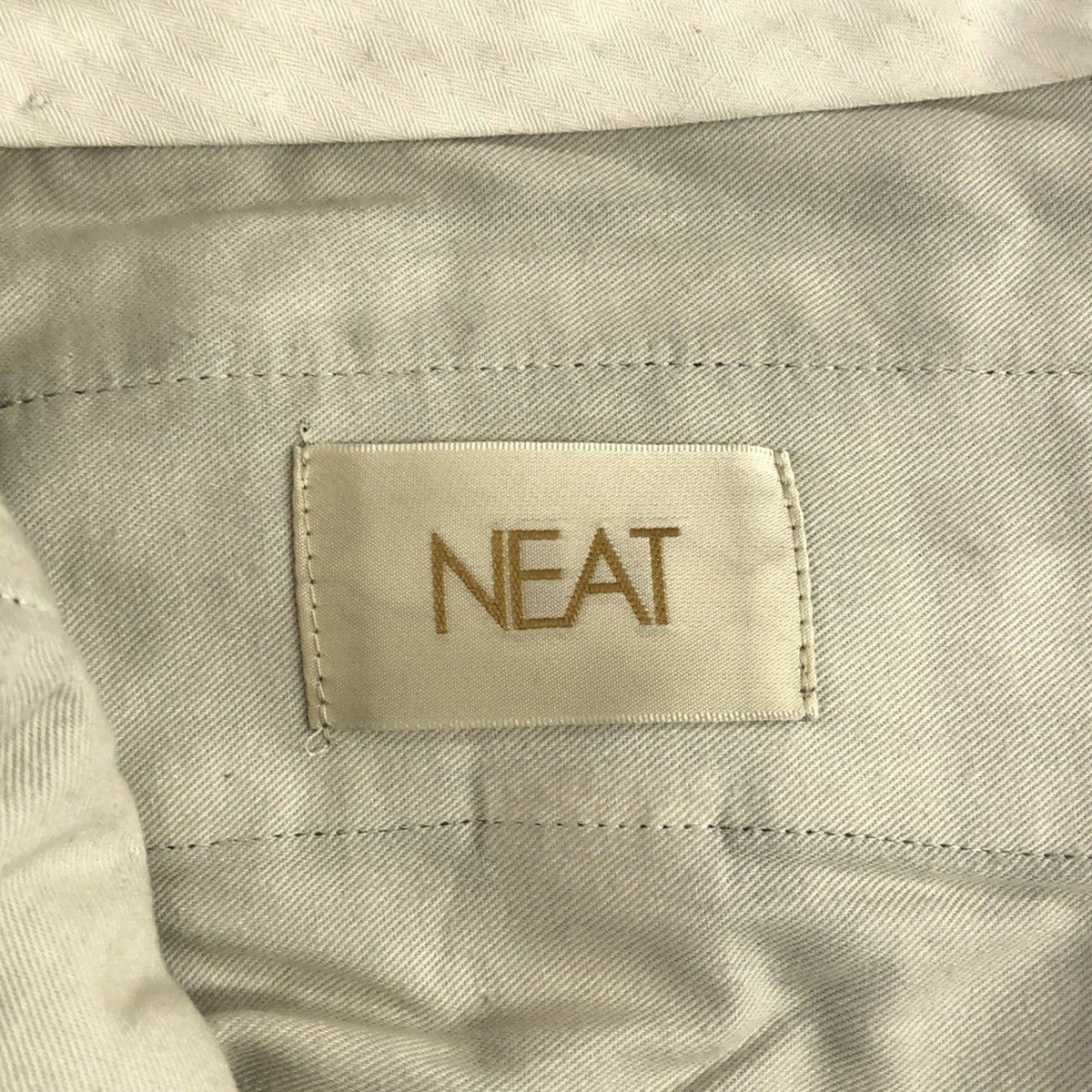 NEAT ニート リネンペーパー テーパードスラックスパンツ グレー