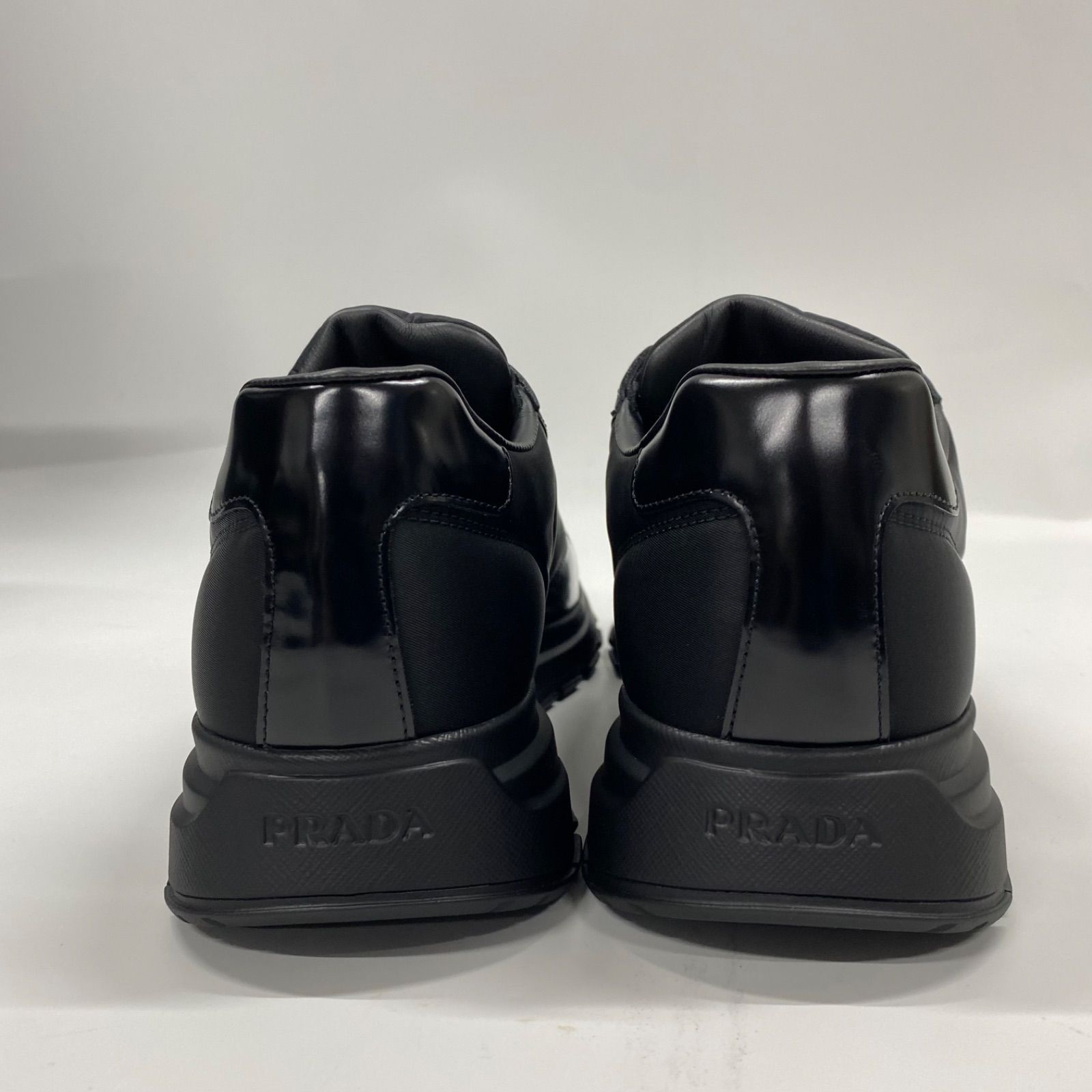 PRADA】プラダRe-Nylon xブラッシュドレザー メンズ スニーカー BLACK 