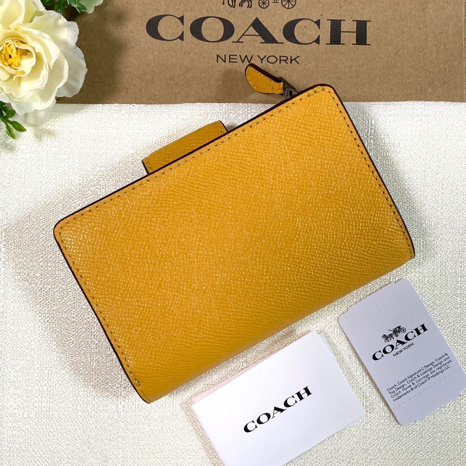 COACH コーチ折り財布イエロー黄色花柄ミニウォレット
