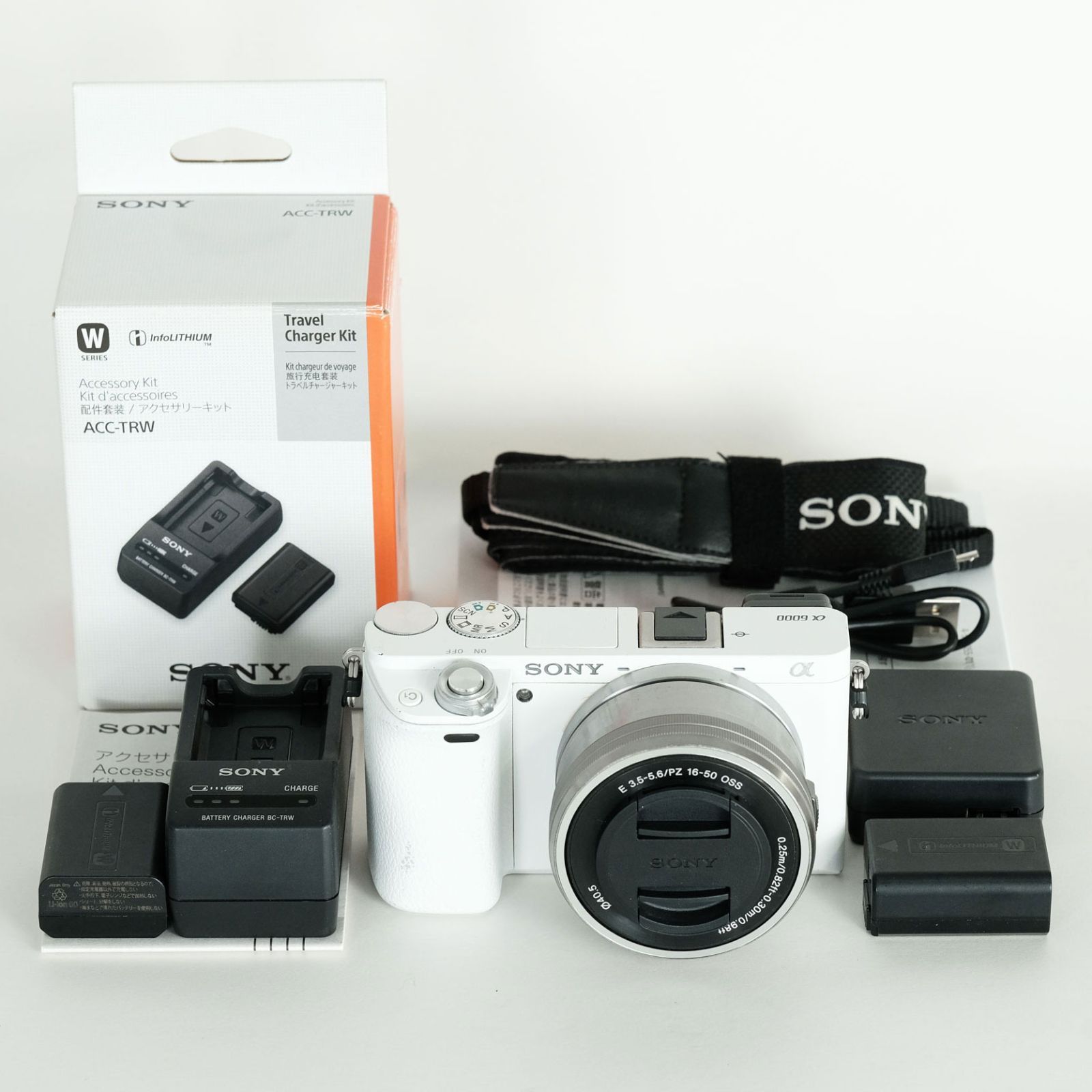 良品｜シャッター数7,801回｜トラベルチャージャーキット付] SONY α6000（ILCE-6000） [パワーズームレンズキット ホワイト] /  ソニーEマウント - メルカリ