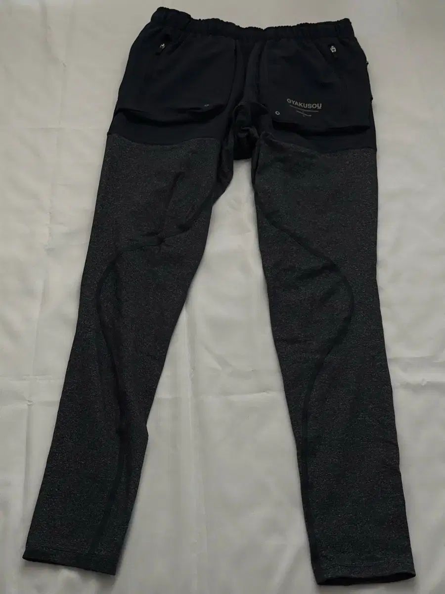 ナイキ x アンダーカバー ギャクソウ ユーティリティ ロングタイツ