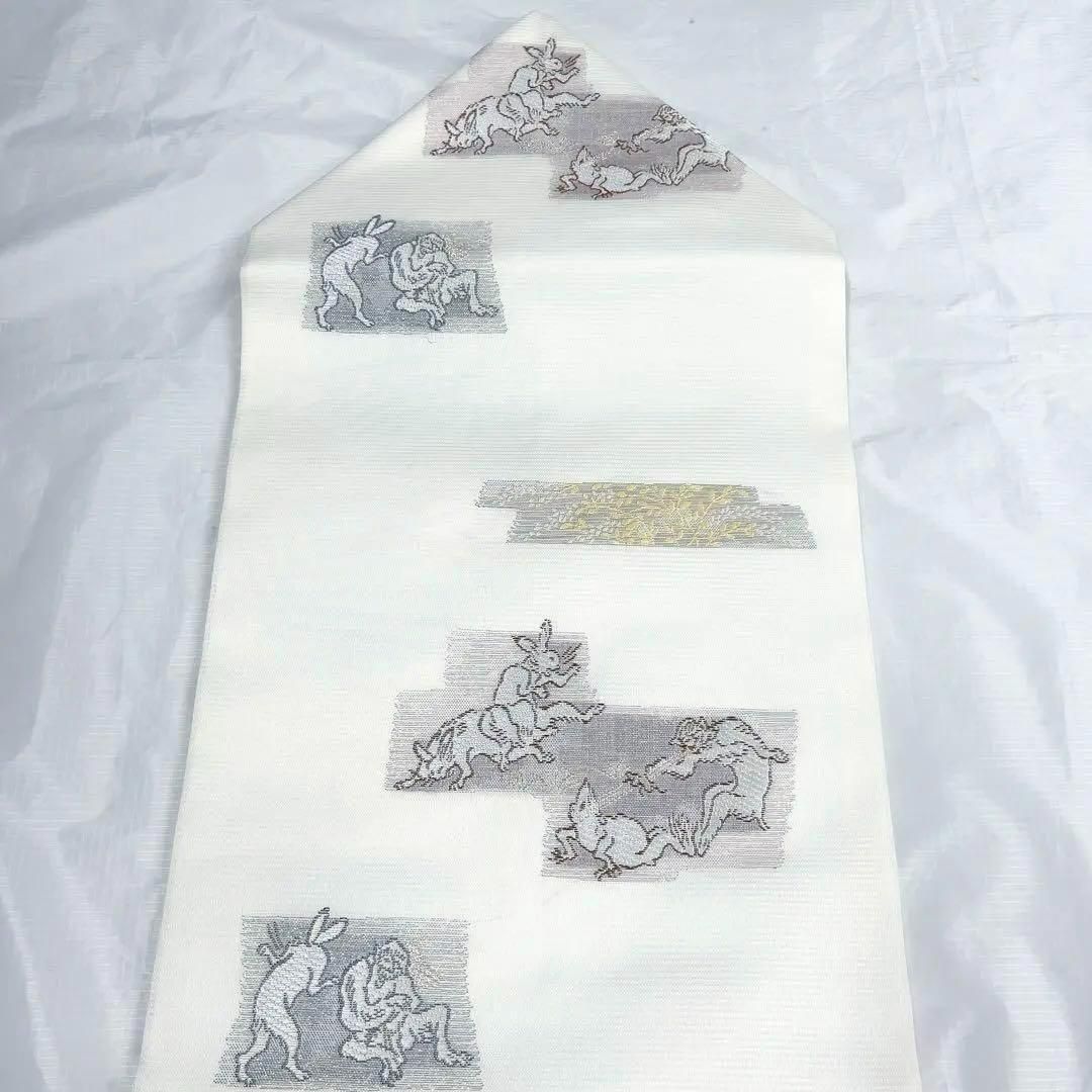 銀座【K-9823】夏紬地 染名古屋帯 濃藍色×天鵞絨色 横段に波や雲など（反端付） - 銀座きもの青木｜長く大切に着続けて頂きたい上質な着物や帯  |ONLINE SHOP 未着用 名古屋帯 夏用 絽 波模様 変わり立涌 水色 着物 043a p 新品未着用　鳥獣戯画模様夏用名古屋帯　お仕立てあがり　着物　絽