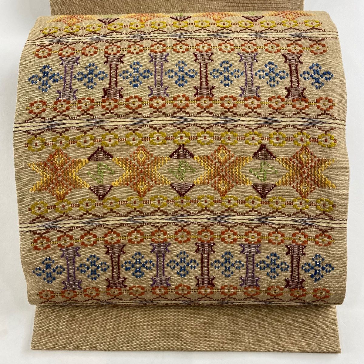 逸品 未使用品 名古屋帯 読谷山花織 茶色 カジュアル お洒落 正絹 名古屋帯 美品 逸品 読谷山花織 草木染 紬地 幾何学模様 縞 山吹茶色