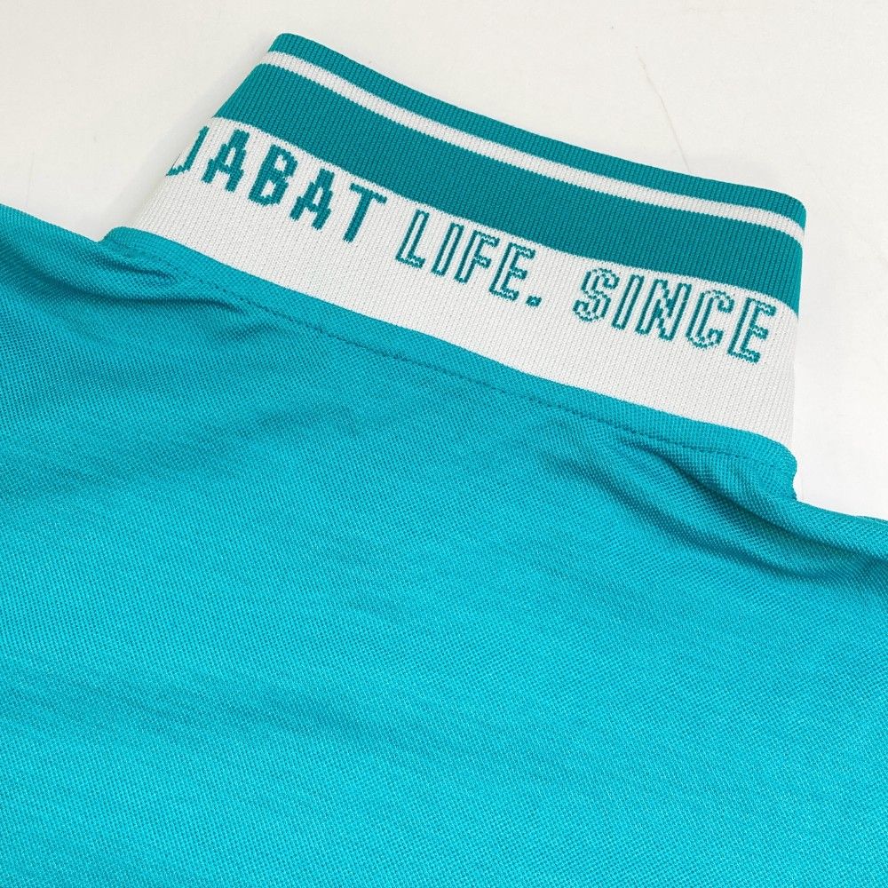 サイズ：36 ADABAT アダバット  半袖ハイネックニットTシャツ  グリーン系 [240101460261] ゴルフウェア レディース ストスト サイズ：36 ADABAT アダバット 半袖ハイネックニットTシャツ