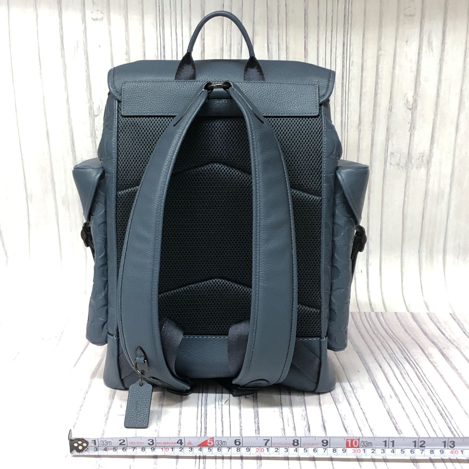 m001 X(100) 新同品 COACH コーチ ヒッチ バックパック・シグネチャー レザー ブルー リュックサック ロゴ エンボス 巾着  デイパック - メルカリ