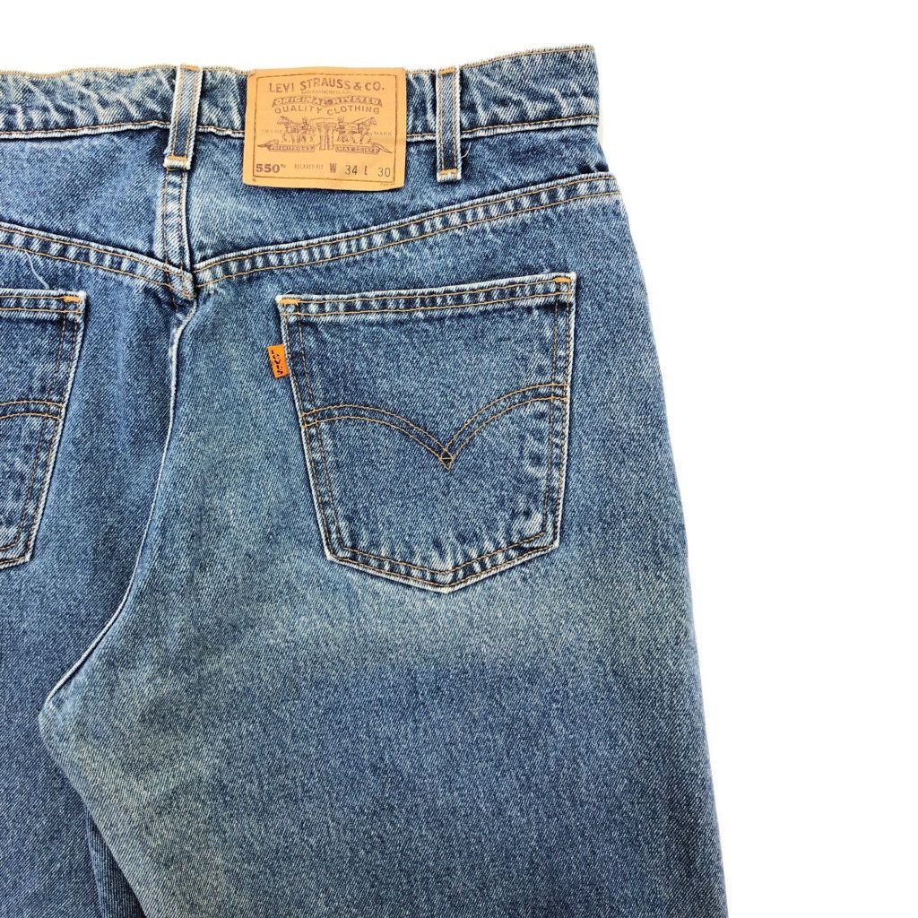 90年代 Levi's リーバイス 550 デニムパンツ オレンジタブ ブルー(メンズ W34 L30)中古 古着 U5368 90年代 Levi's リーバイス 550 デニムパンツ オレンジタブ ブルー