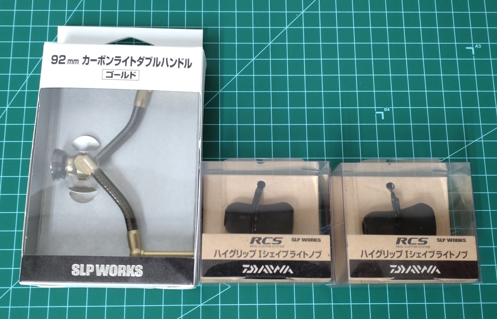 66. ダイワ SLPW カーボンライトダブルハンドル|ゴールド RCS ハイグリップI型ライトノブ×2 セット 店舗併売品