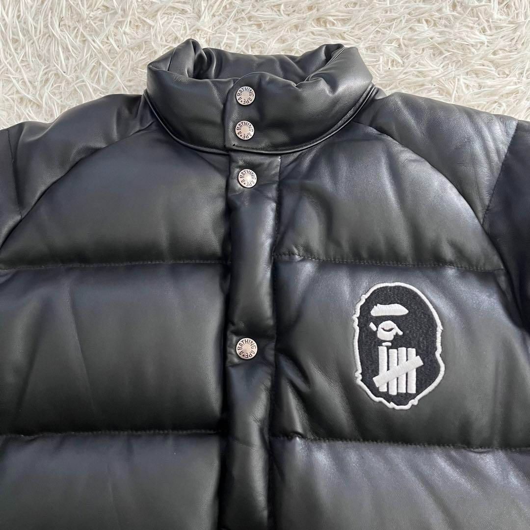 人気 A BATHING APE × UNDEFEATED アベイジグエイプ×アンディフィーテッド シープスキン レザー ブラック ダウンジャケット  防寒 厚手 L 軽量 暖かい 保温 防水 男女兼用 通学 通勤 人気 中綿ジャケット 秋冬春 黒 山羊革