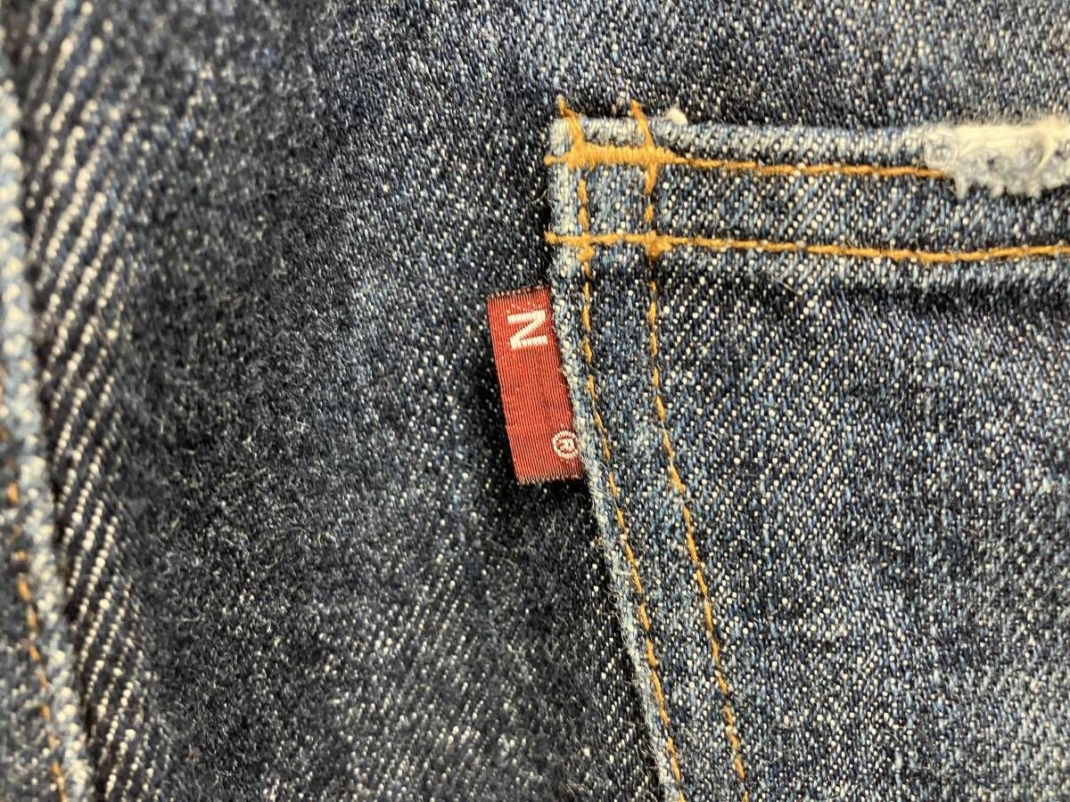 紫タグ ジーンズ