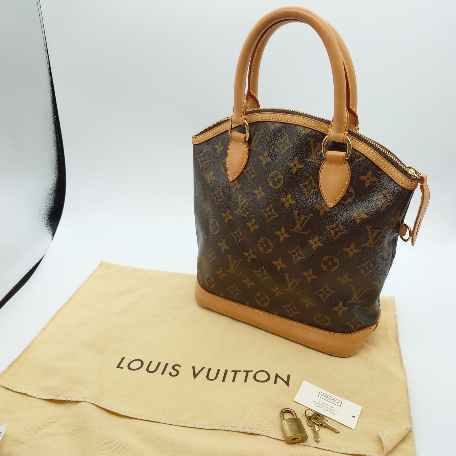 ルイヴィトン Louis Vuitton ロックイット バッグ モノグラム ハンドバッグ シンプル シック 自立 ロゴデザイン おしゃれ 上品  エレガント ブラウン ゴールド PVC レザー M40102 レディース 【中古 B品】 当店通常価格119300円 - メルカリ