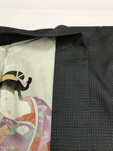 黒地に蚊絣文様の紬 袖継ぎ