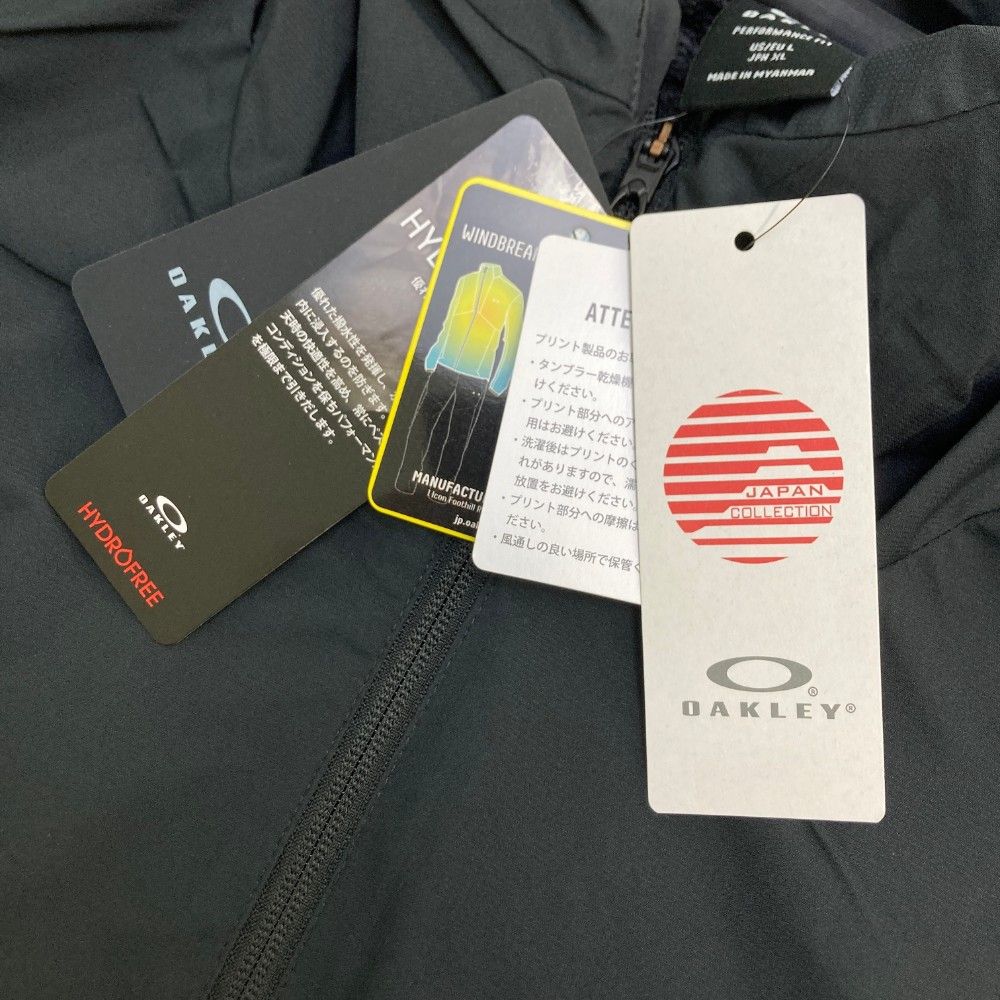 サイズ：XL OAKLEY オークリー FOA406887 ジップジャケット  ブラック系 [240101460573] ゴルフウェア メンズ ストスト サイズ：XL OAKLEY オークリー FOA406887 ジップジャケット