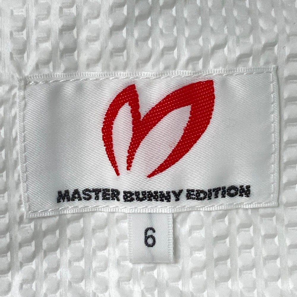 サイズ：6 MASTER BUNNY EDITION マスターバニーエディション  薄手 ナイロン ジップジャケット  ホワイト系 [240101443052] ゴルフウェア メンズ ストスト サイズ：6 MASTER BUNNY EDITION マスターバニーエディション
