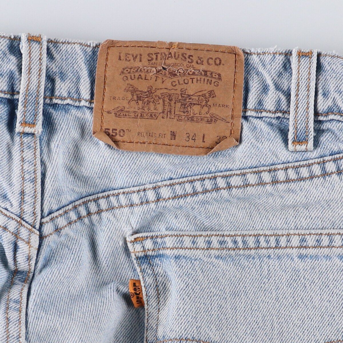 オレンジタブ テーパードデニムパンツ