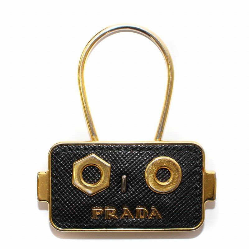 PRADA - プラダ キーホルダー チャーム ロゴ ロボット バイカラー 黒 ゴールド色 プラダ PRADA キーホルダー チャーム ロゴ ロボット バイカラー
