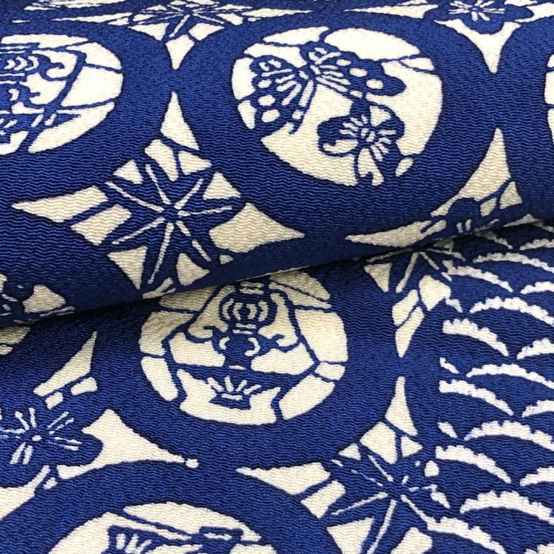 名古屋帯 型染 丸に鳥 蝶々 花草模様 雪芝 縮緬 瑠璃色 O-5133