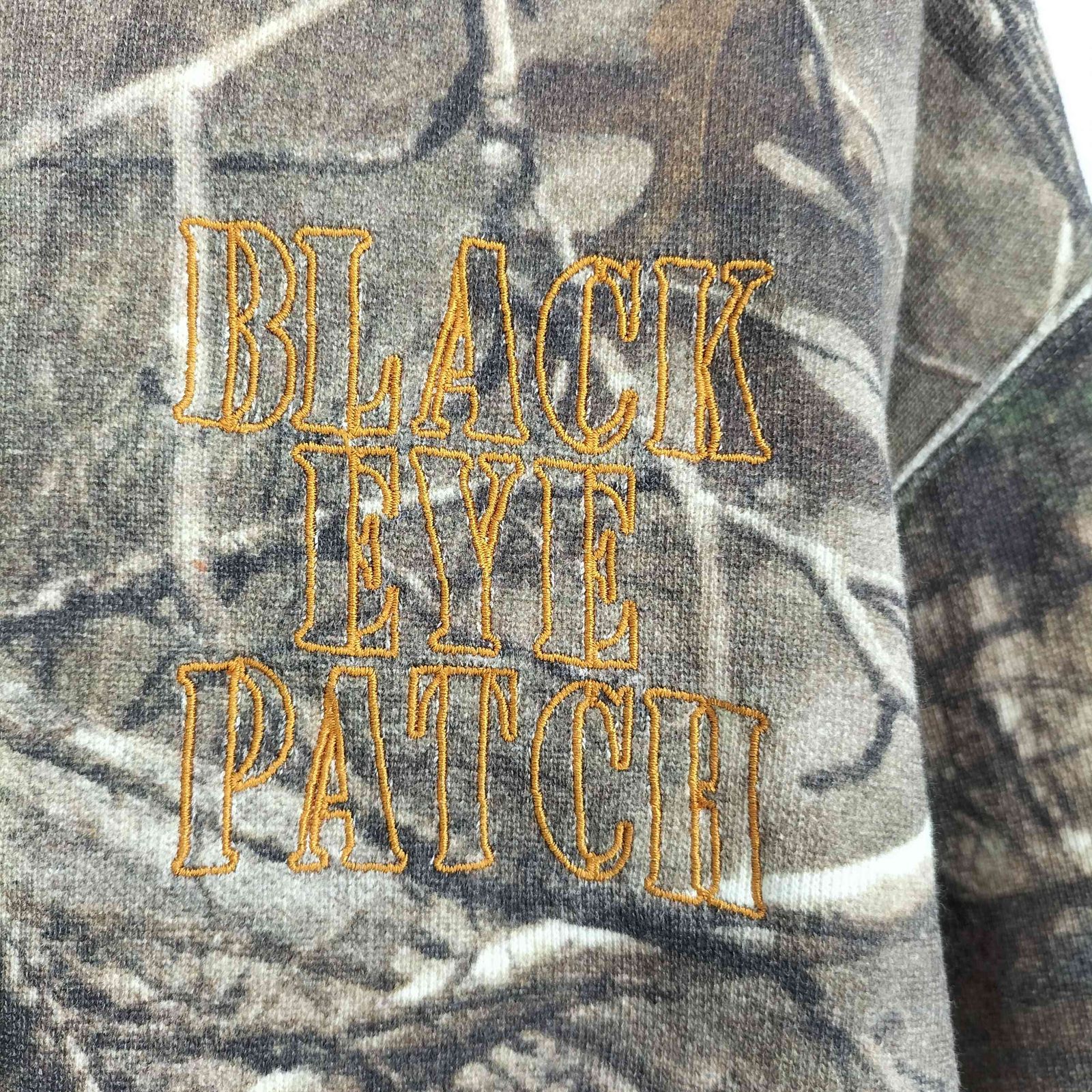 ザブラックアイパッチ THE BLACK EYE PATCH STENCIL LOGO REALTREE 