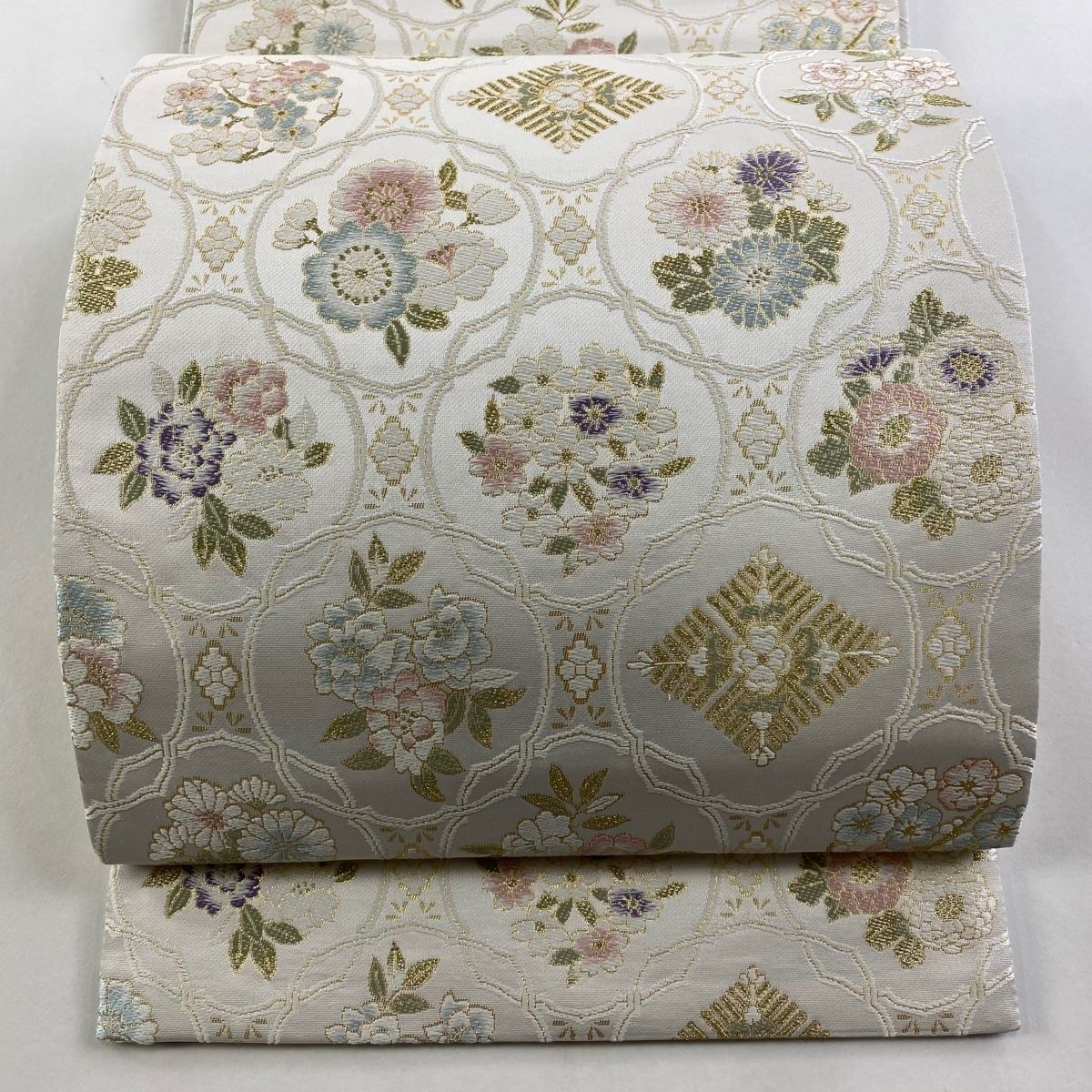 袋帯 美品 名品 尾峨佐 リバーシブル 草花 花菱 金糸 箔