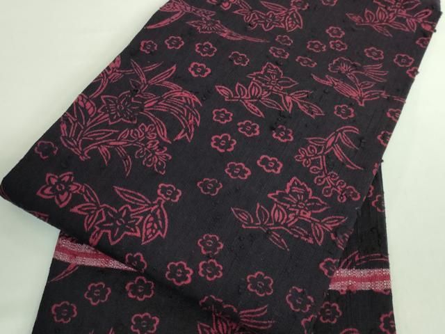 平和屋本店□極上 浦野理一 経節紬 型染 九寸名古屋帯 草花文 烏羽色地