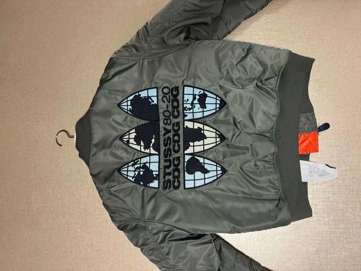 STUSSY CDG 40周年 MA-1ジャケット オリーブグリーン STUSSY