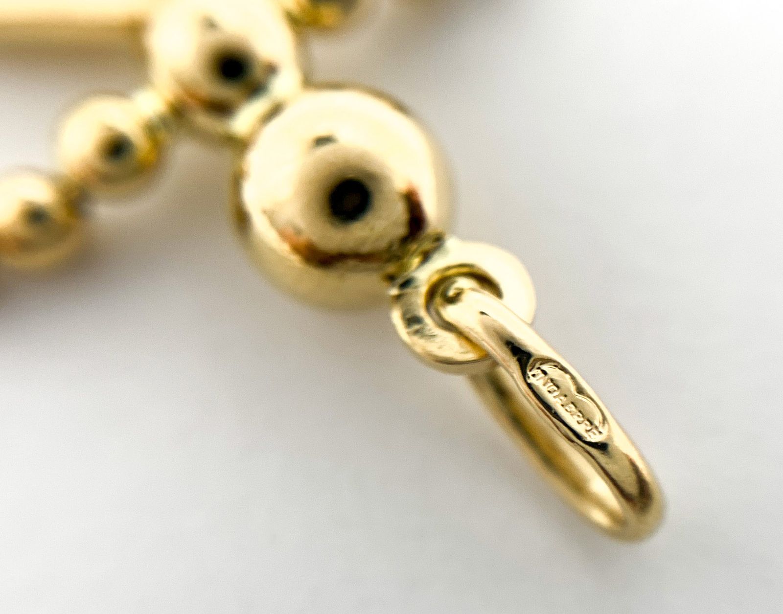 美品　UNOAERRE ウノアエレ　18K リボンチャーム 楽天市場】ウノアエレ UNOAERRE ペンダントトップ・チャーム