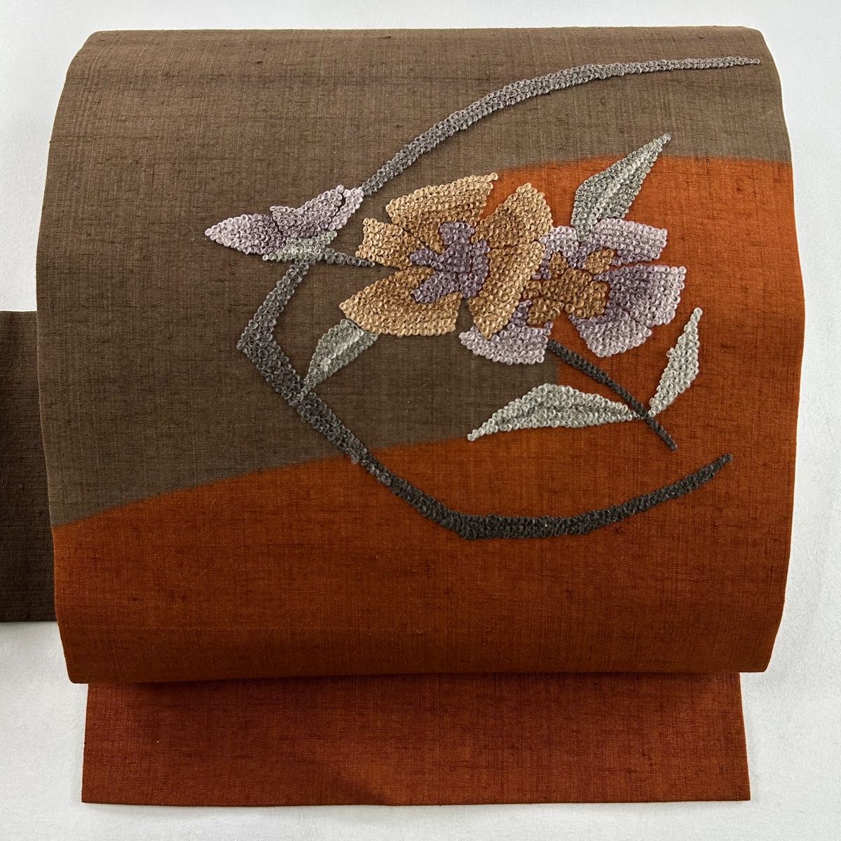 名古屋帯 秀品 紬地 草花 刺繍 茶色 正絹