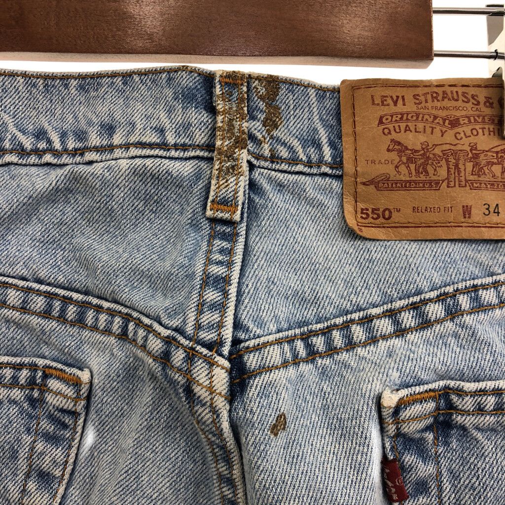 90年代 USA製 Levi's リーバイス 550 リラックスフィット デニムパンツ ボトムス アメカジ ブルー (メンズ 34×34) 中古 古着  P7043