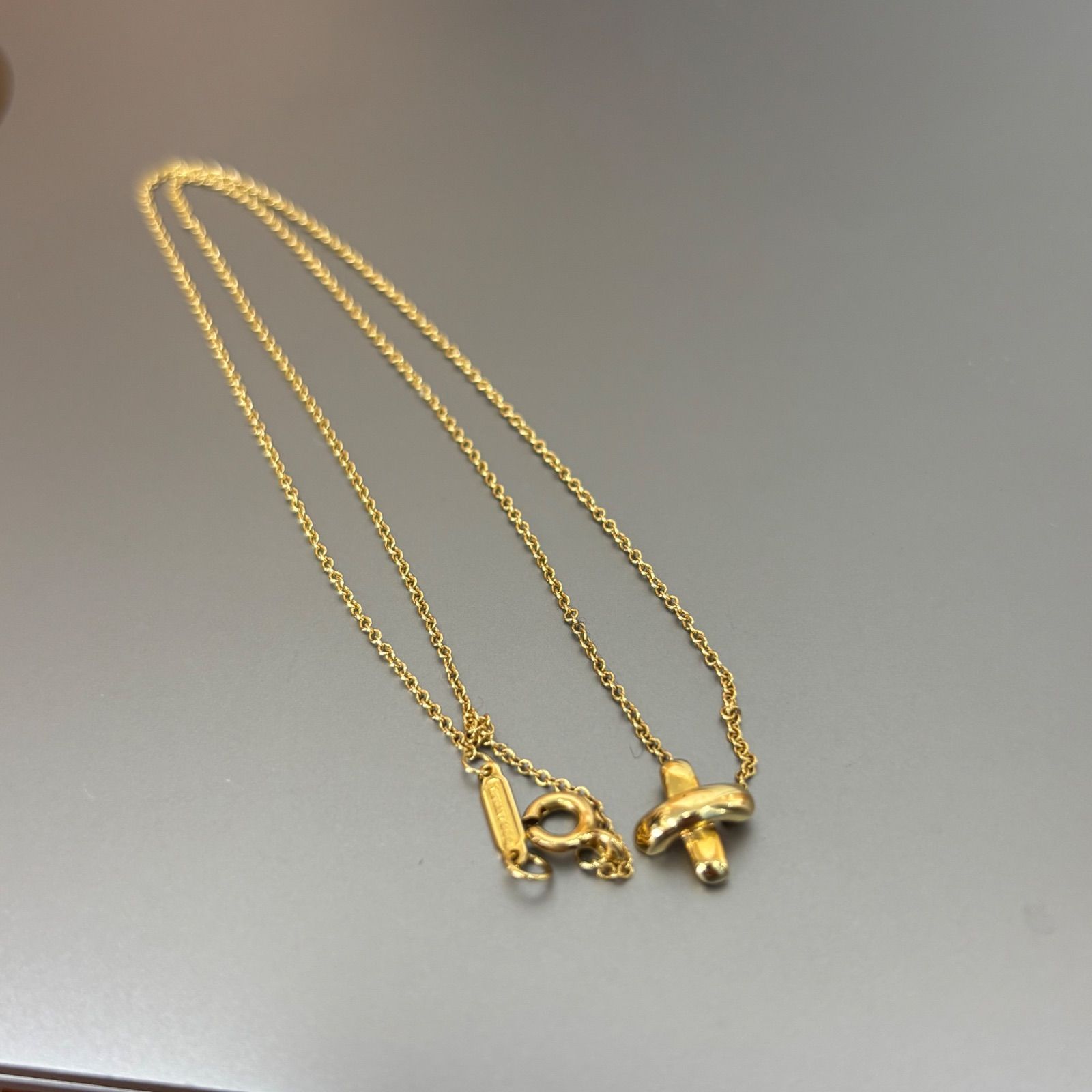 ティファニー クロス ステッチ 750 k18 YG ネックレス - メルカリ