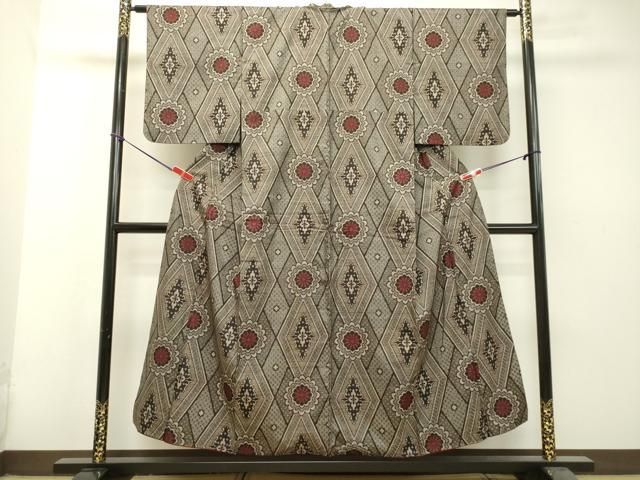 平和屋着物○希少 本場大島紬 龍郷絣 7マルキ 花菱文 正絹 逸品  