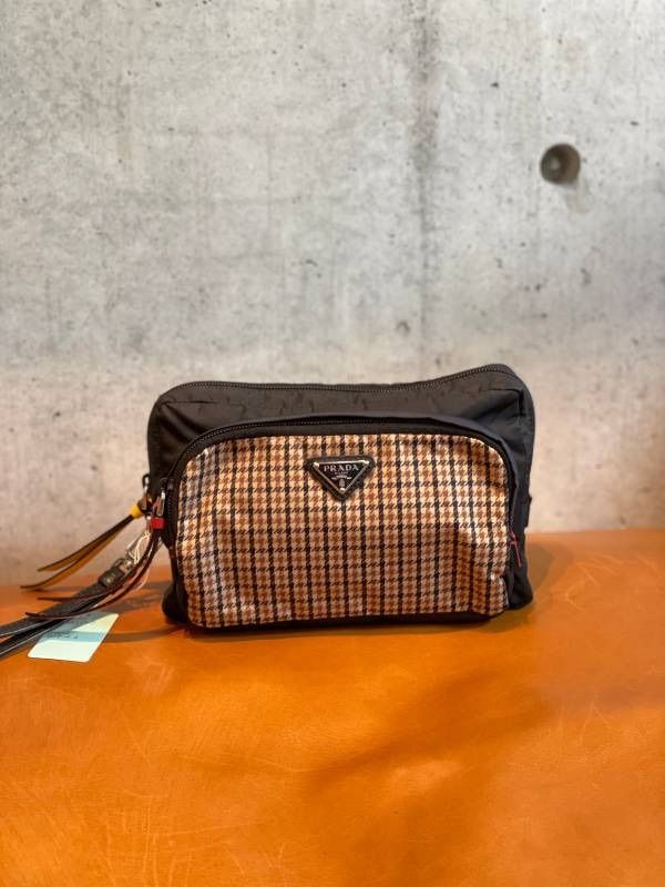 プラダ 巾着ポーチ 三角ロゴ ナイロン レザー オレンジ ハンドル付き