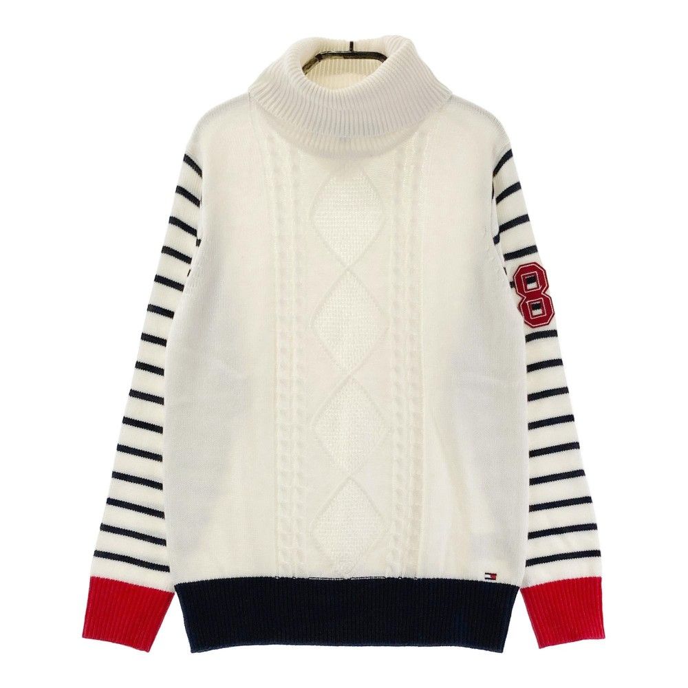 サイズ：M TOMMY HILFIGER GOLF トミー ヒルフィガーゴルフ  タートルネック ニットセーター 袖ボーダー柄 ホワイト系 [240101375310] ゴルフウェア レディース ストスト