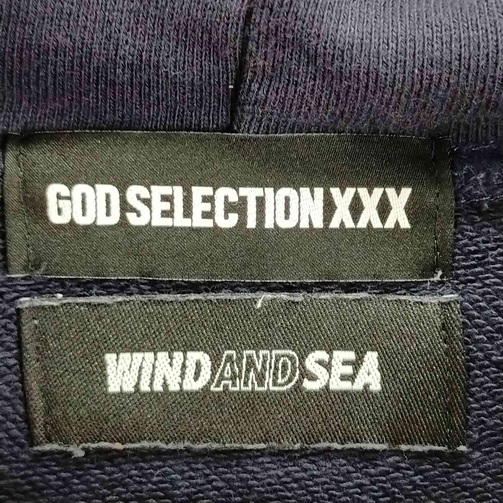 ウィンダンシー WIND AND SEA 別注 ロゴプリントパーカー メンズ 表記  