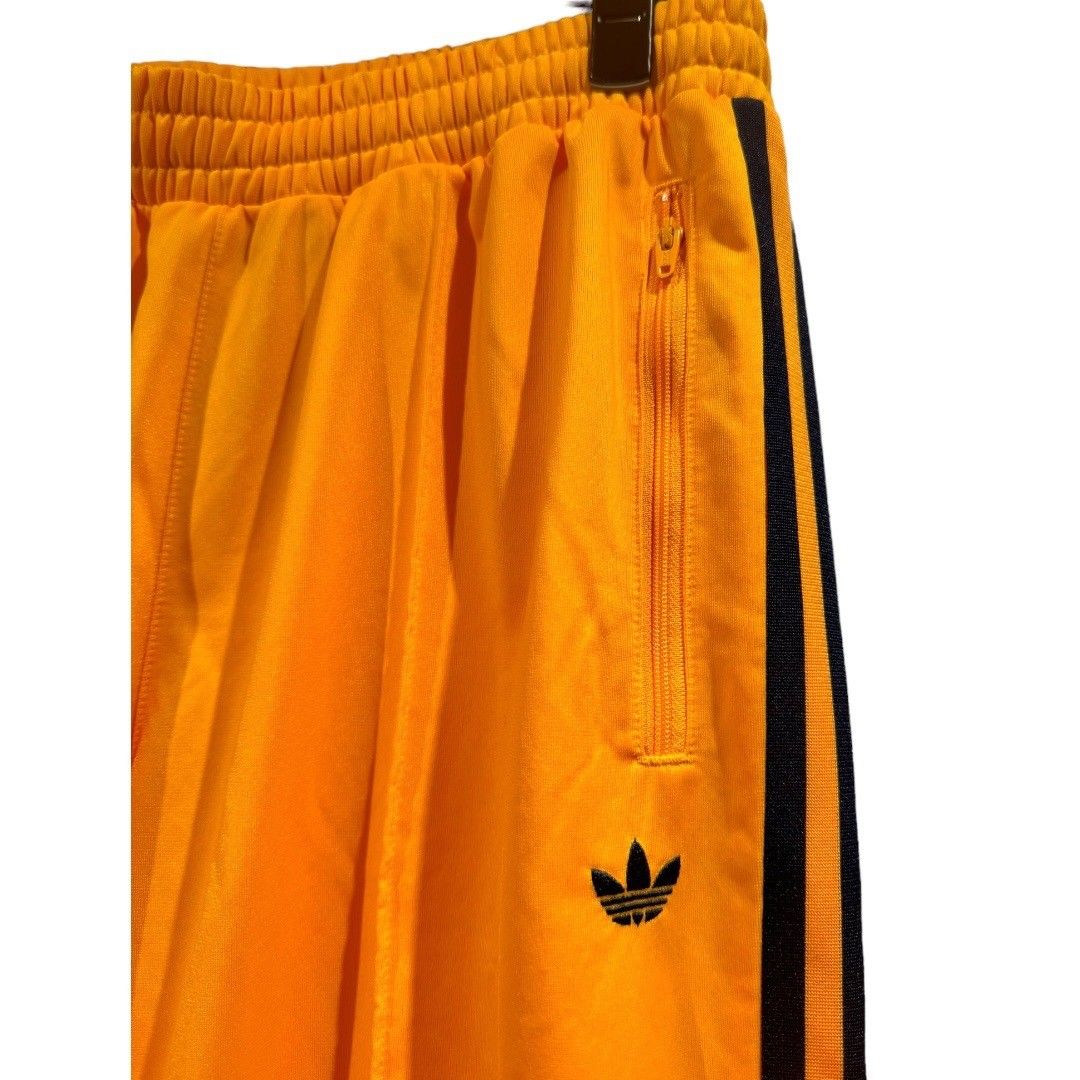ADIDAS ベッケンバウアー トラックパンツ オレンジ ジェンダー ADIDAS ベッケンバウアー トラックパンツ オレンジ ジェンダー