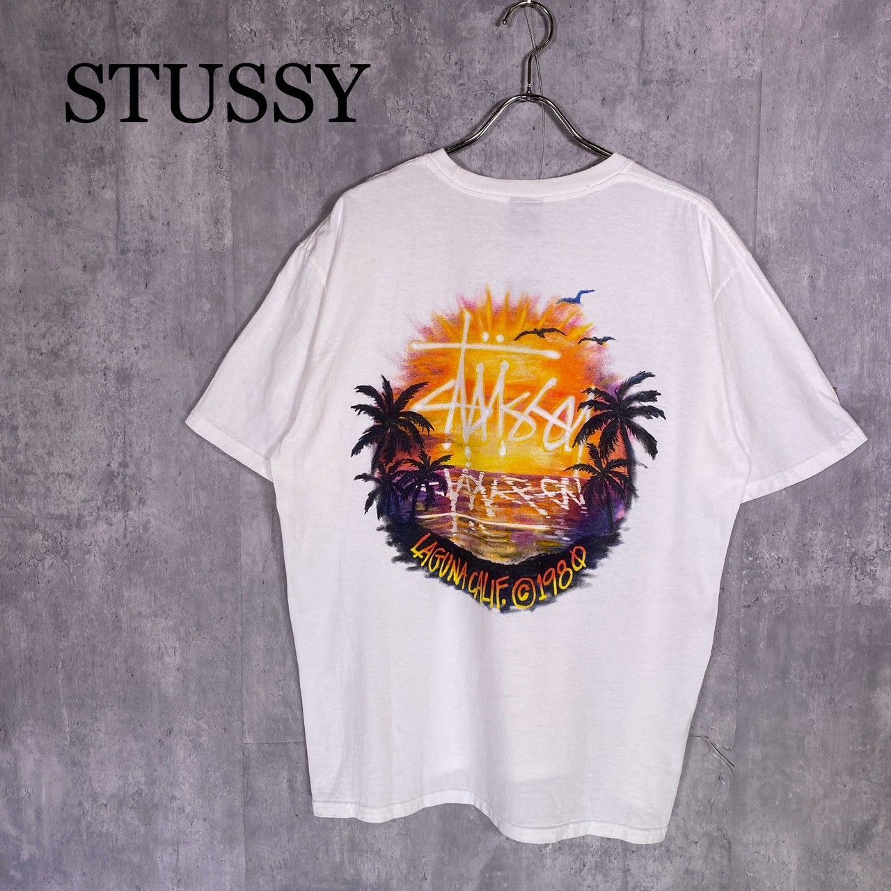STUSSY』ステューシー (L) サンセットデザインTシャツ - メルカリ
