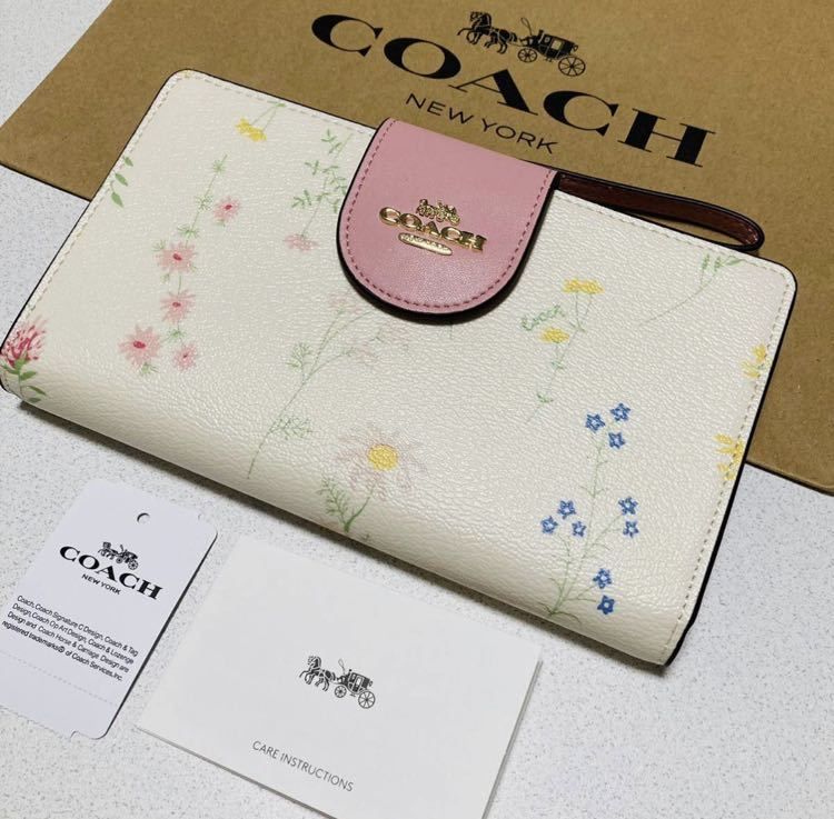 新品　COACH 二つ折り財布　花柄　シグネチャー　フローラル　ピンク
