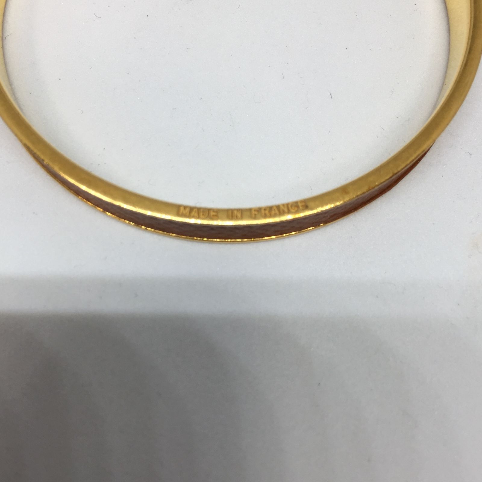 HERMES ゴールド オレンジ バングル HERMES エルメス ケリーバングル オレンジ ゴールド金具 - メルカリ