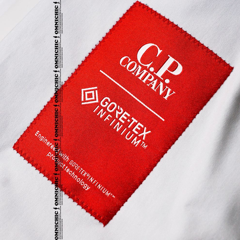 C.P.カンパニーゴアテックスネイビーベルテッドロングコートジャケット 14CMOW014A