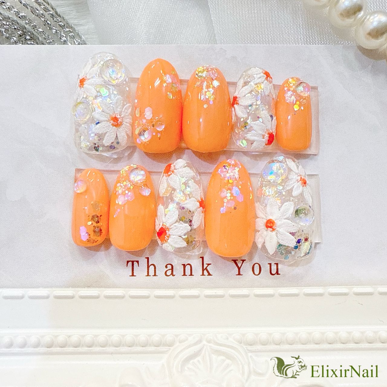 現品】ネイルチップ オレンジ 花柄 ホワイト - メルカリ