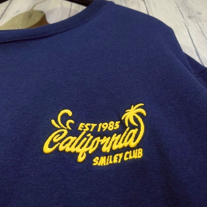 ブートレガーズ　スマイリー　Tシャツ 夏物新作【Smiley Face×Cali Surf】 スマイリー1985ロゴサガラ