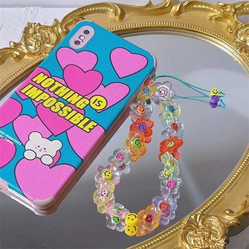 レトロなフラワーニコちゃんスマホストラップ♡ - メルカリ